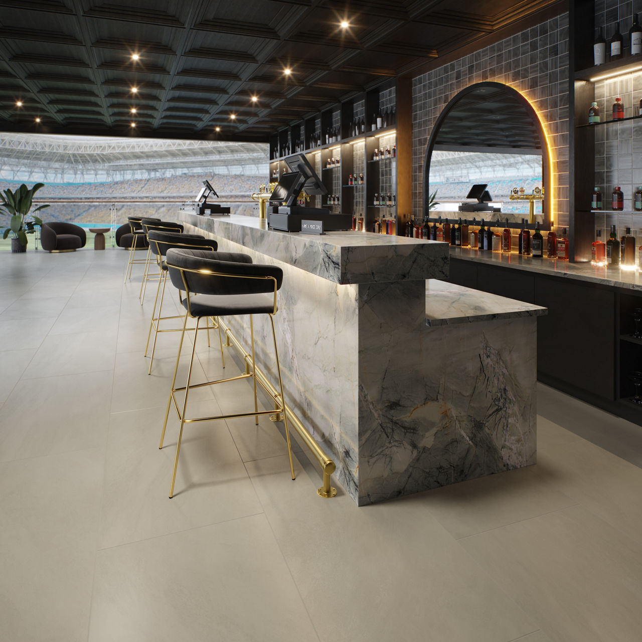 Bar in stadium with blue natural quartzite bar, black chairs, gray concrete look rectangle floor tile, blue square wall tile, and view of stadium in background.