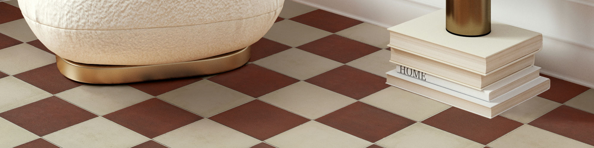 Living room with red and white square floor tile, small white chair, and small lamp.