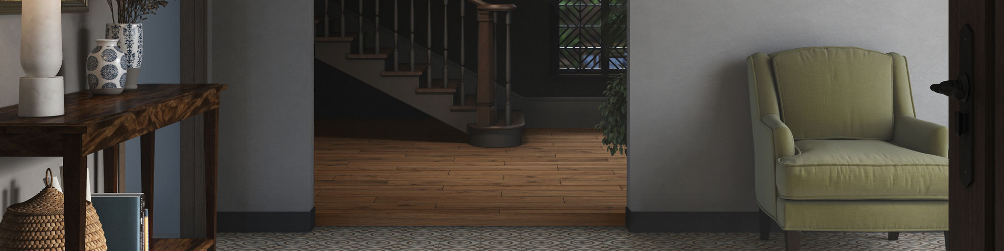 A stylish entryway features a patterned tile floor and a wooden console table with a lamp and decorative items. An olive green armchair sits against a gray wall, accented by framed artwork. The space opens to a staircase with a chandelier, and the ov