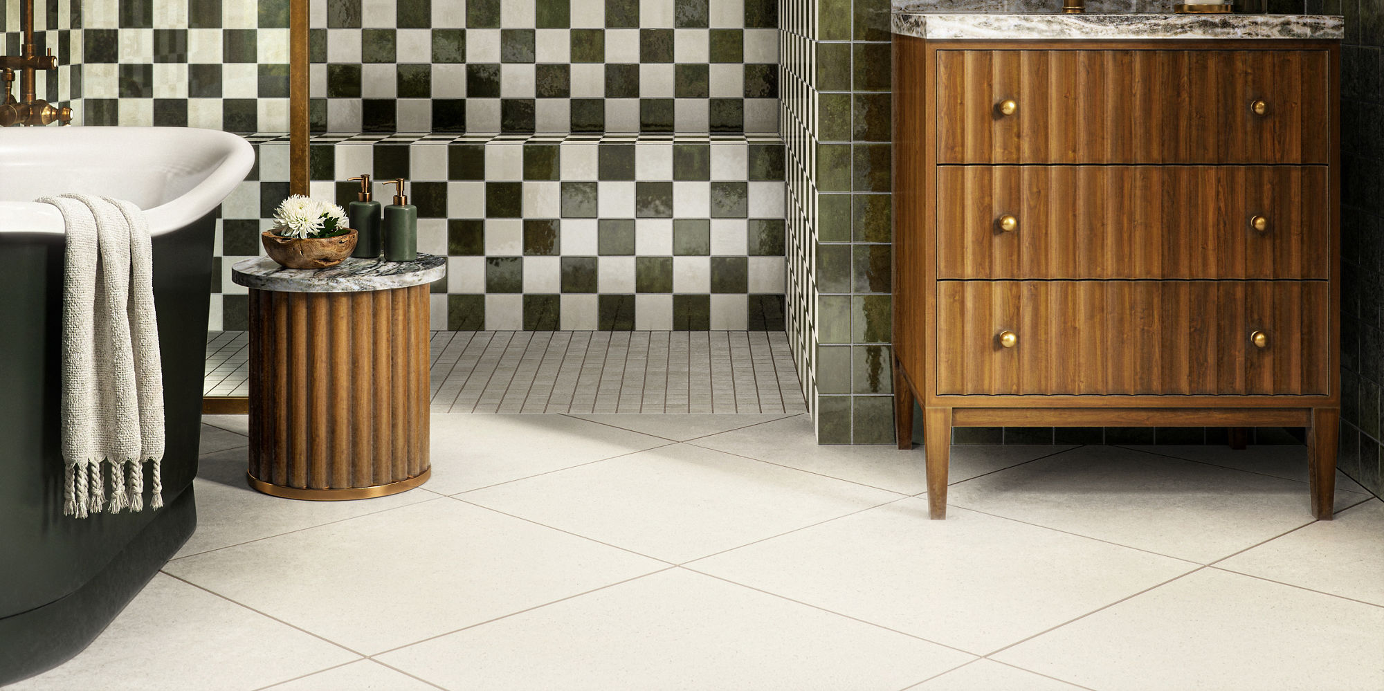 A contemporary bathroom features a striking black and white checkered tile wall and a sleek freestanding bathtub.