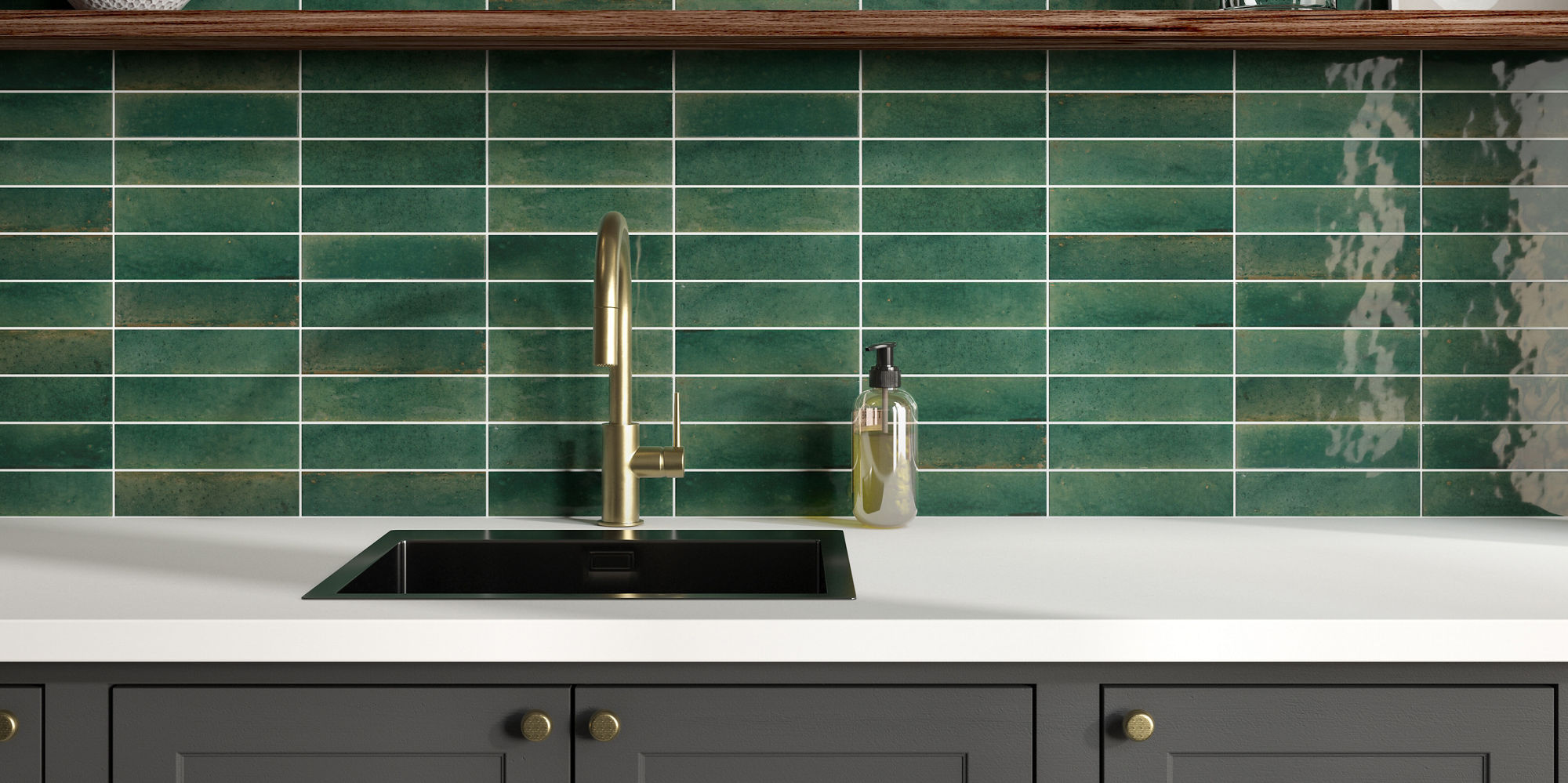 Kitchen with green rectangle wall tiles on back wall and backsplash, white countertop, brown shelves, and gray cabinets.