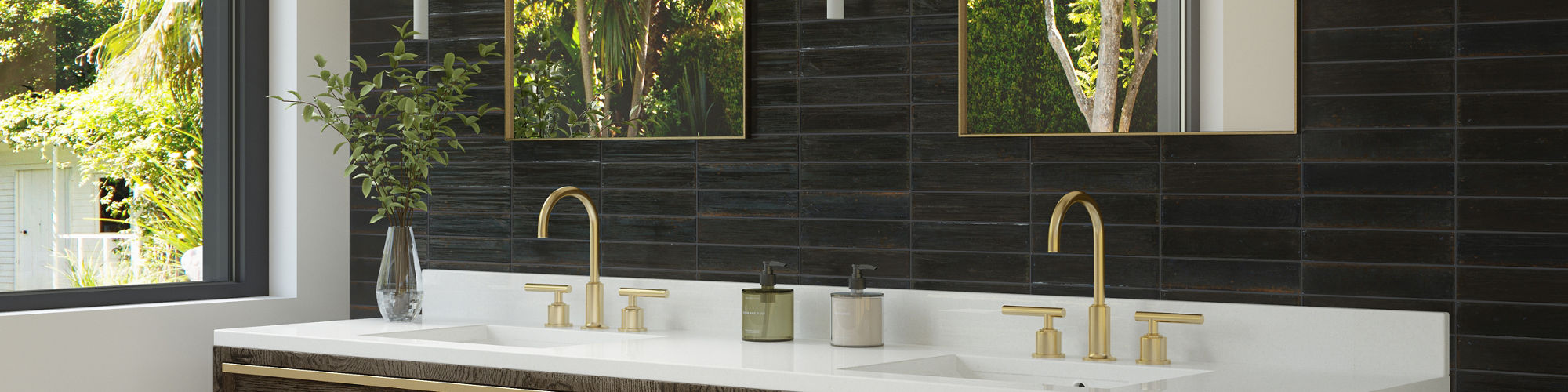 Bathroom double sink with black rectangle wall tile, white sinks, and gold accents.