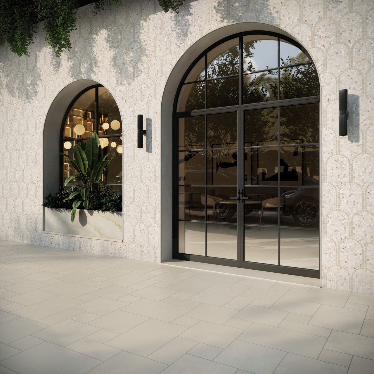 A contemporary storefront features a large glass door beside an arched display window. Inside, warm pendant lights and lush indoor plants create an inviting atmosphere. The exterior wall is clad in patterned tiles with climbing greenery cascading fro