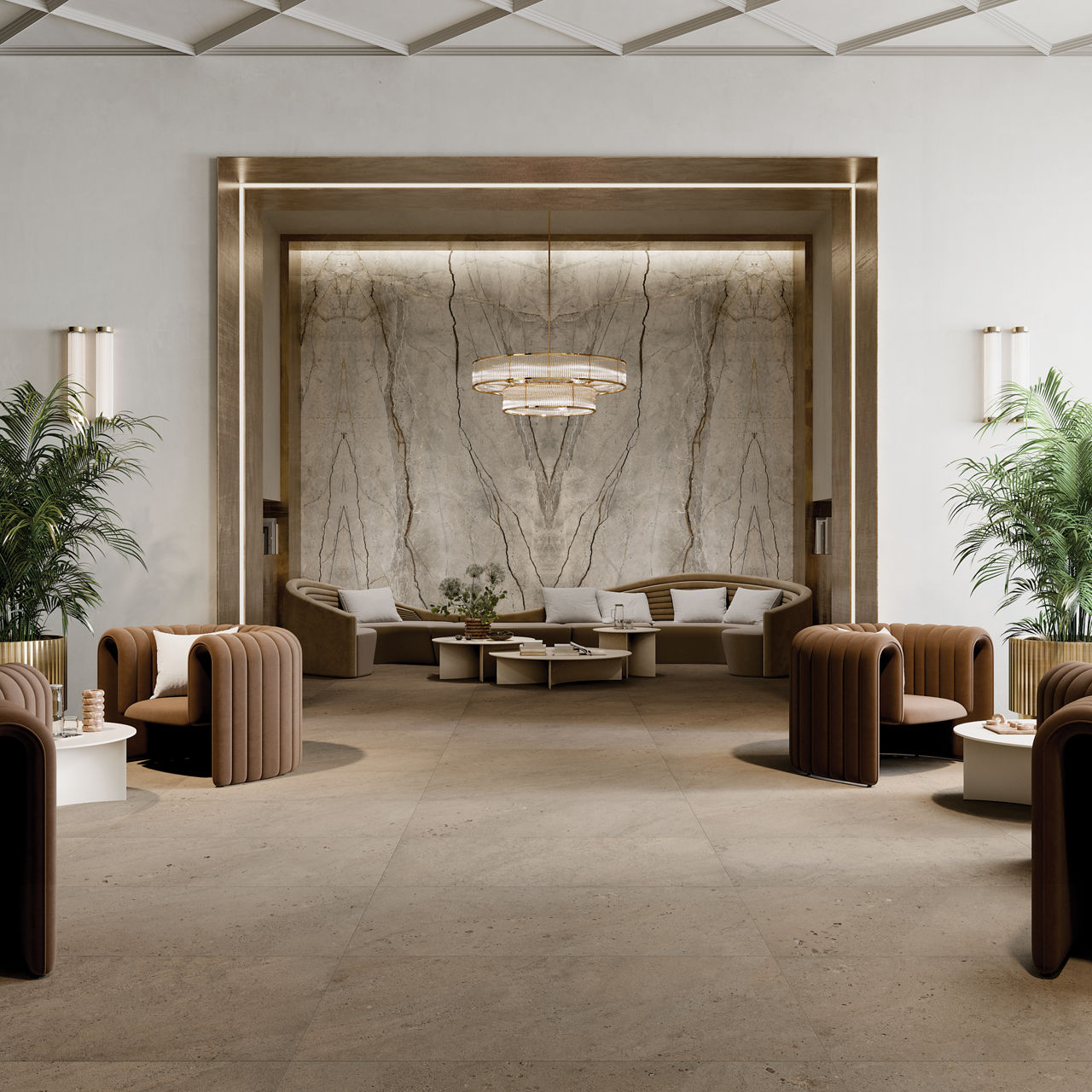A contemporary hotel lobby features a striking marble accent wall framed by gold trim. Plush brown and beige armchairs are arranged around low tables, with potted plants adding greenery to the space. The setting is illuminated by a modern chandelier,