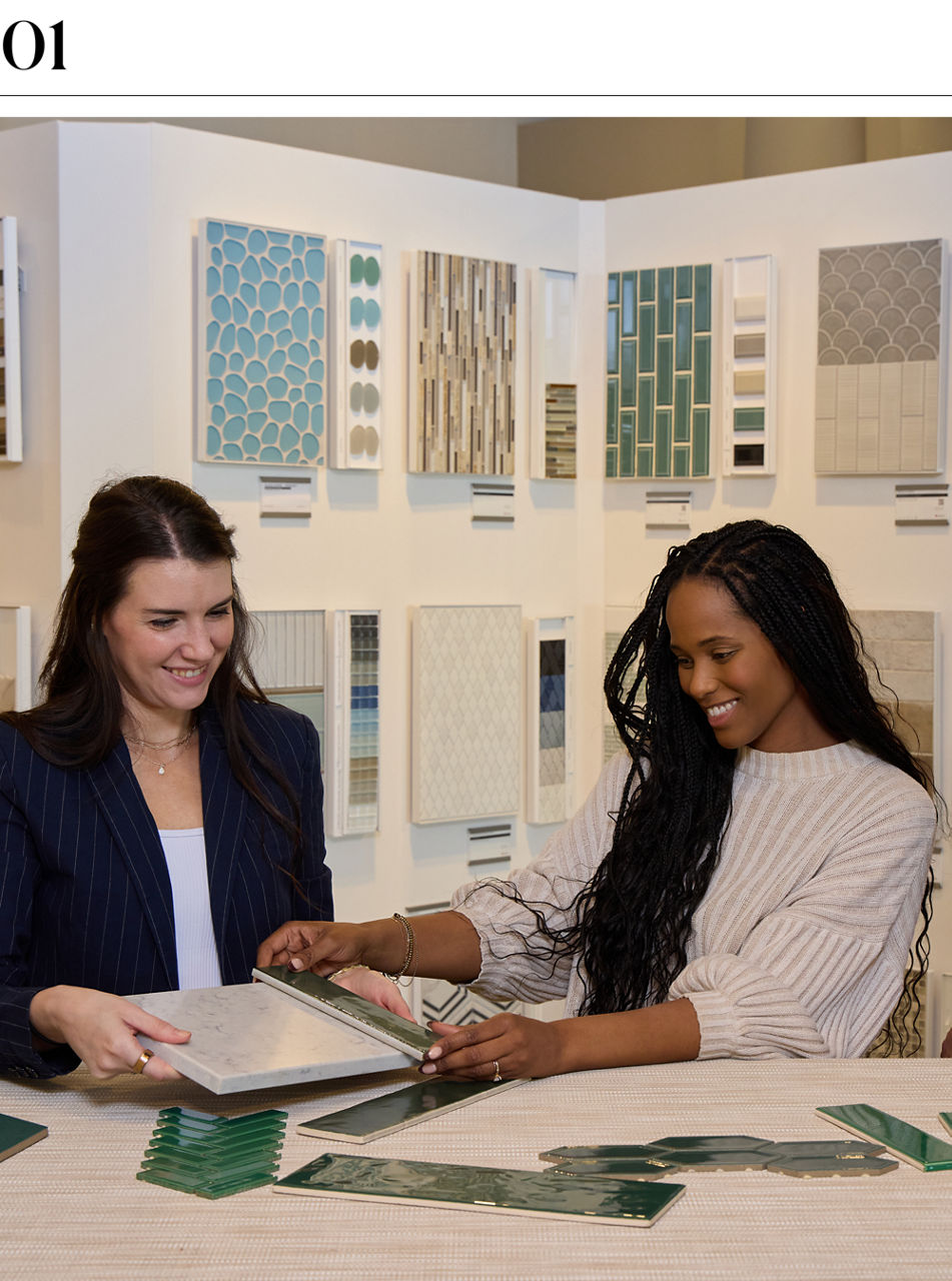 Customers explore tile options with showroom design consultants during a guided selection session.