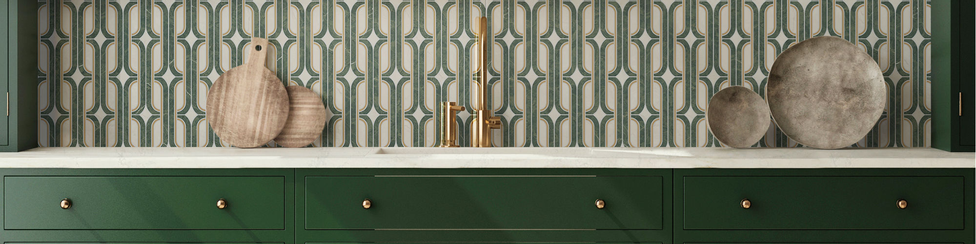 Kitchen with green cabinets, green encaustic mosaic on backsplash and wall, white countertop, and gold accents.