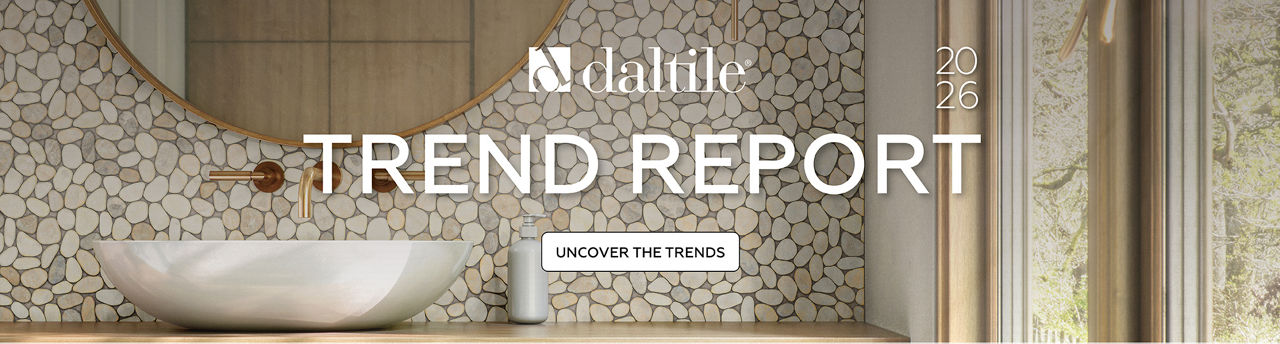 Bathroom with a pebble?pattern feature wall, round mirror, floating wood vanity, vessel sink, and large window with natural light.