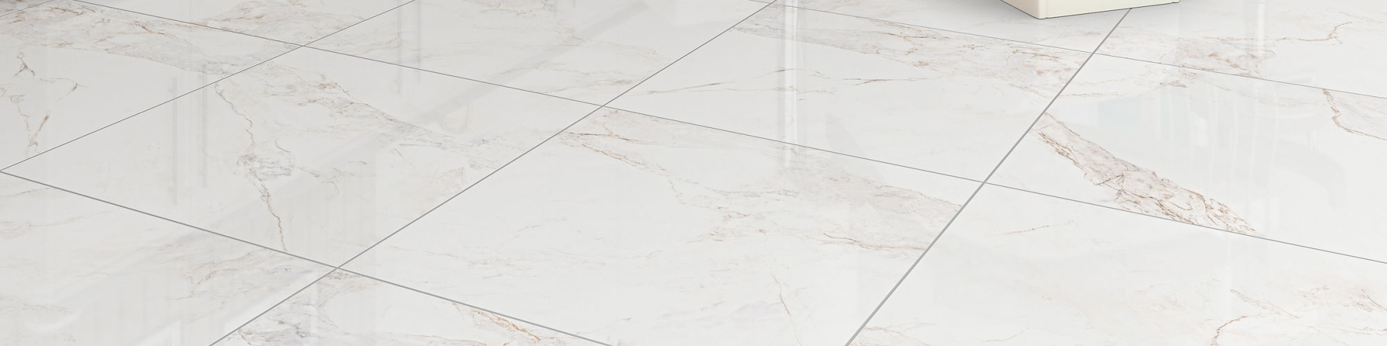 Dental office chair with white marble look square floor tile, white cabinets, and a beige dental chair.