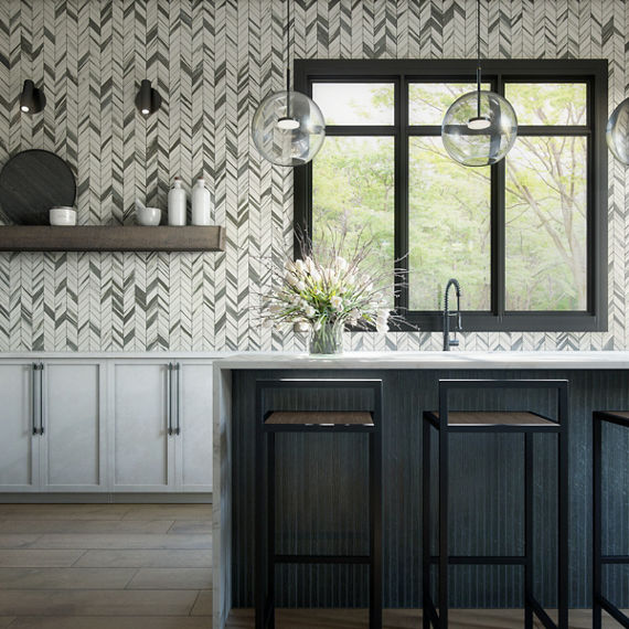 Kitchen with a stone look chevron mosaic on wall, dark wood accents, white cabinets, and bar chairs at center island.