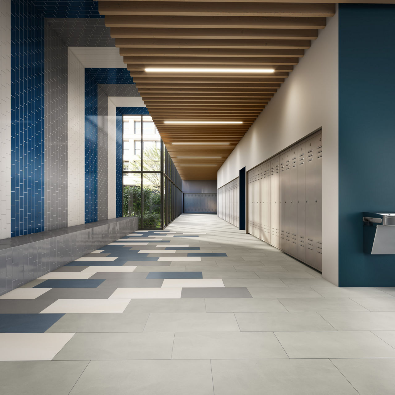 Hallway with gray rectangle concrete look floor tiles, white and blue rectangle floor tiles, and white, blue, and gray walls.
