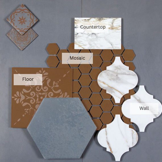 This flatlay contains a white marble look countertop, white marble look arabesque tile, encaustic orange concrete look tile, orange concrete look hexagon mosaic, and gray hexagon tile.
