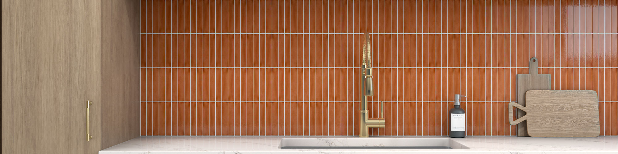 Contemporary kitchen cabinetry frames a central sink area with a striking orange tile backsplash. Open wooden shelves display dishes, bowls, and decorative objects above a white countertop. A sleek faucet and a single bottle add minimal accents to th