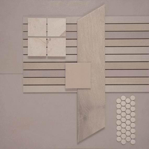 This tile flatlay contains a concrete look tile accented by a long wood look tile, solid concrete look tile, square marble mosaic tile, penny round mosaic tiles, and a large undulated tile.