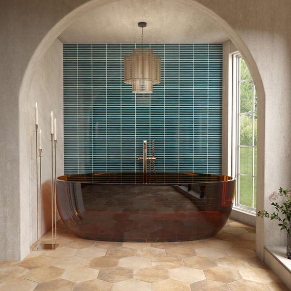 Bathroom with red bathtub, orange hexagon floor tile, white walls, and blue fluted tile on back wall.