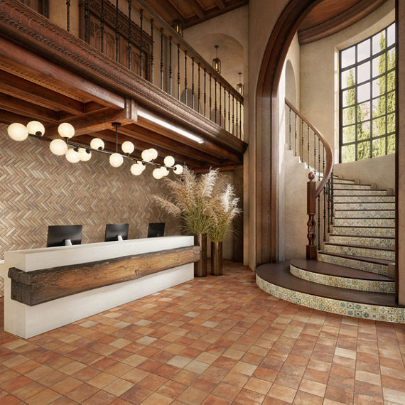 Welcome area with orange cotto look square floor tile, white and green encaustic square tile on stairs, and wood accents.