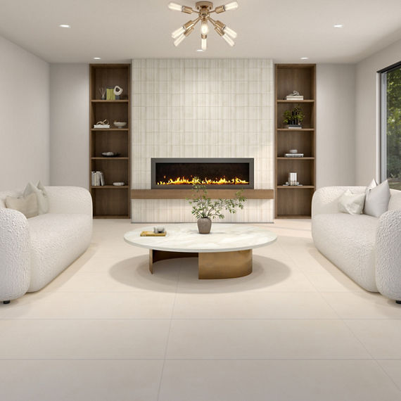 Living room with white square large format concrete look floor tile, two white couches, wood accents, and a fireplace in the middle.