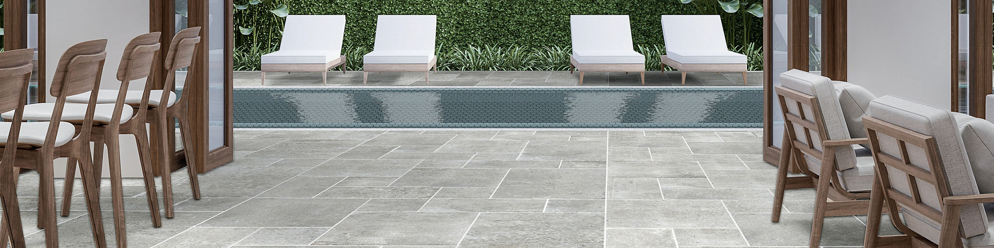 Spa with gray stone look square floor tile, white lounge chairs, and a pool with white pool chairs.