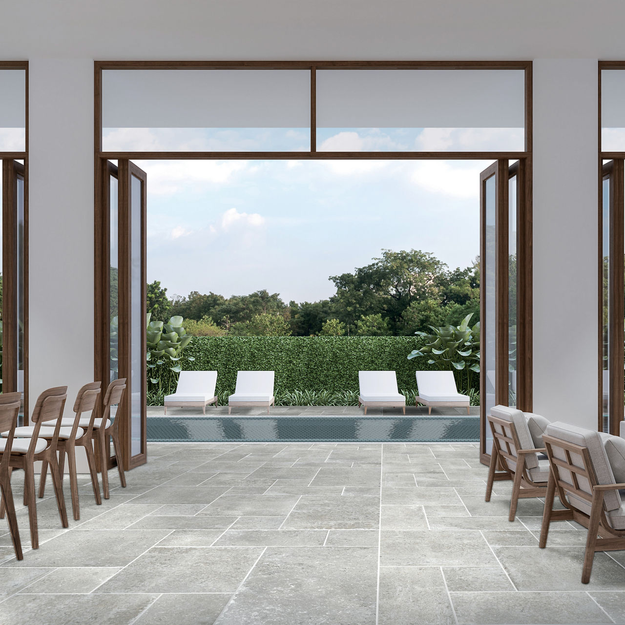 Spa with gray stone look square floor tile, white lounge chairs, and a pool with white pool chairs.