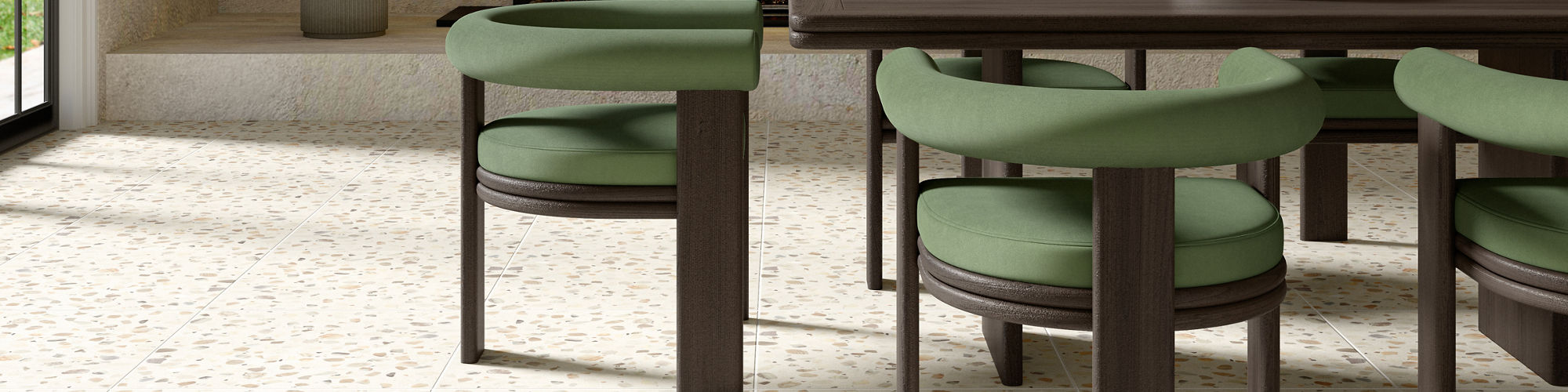 Dining room with white terrazzo look square floor tile, green dining chairs, dark wooden dining table, and a fireplace in the back.