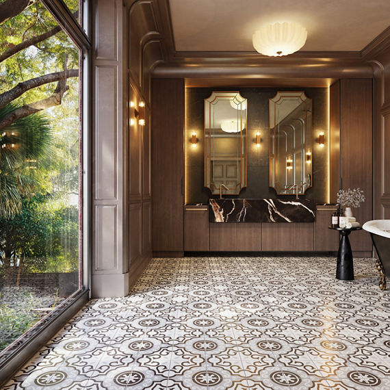 Bathroom with white encaustic square floor tile, wooden walls, black marble look sink, large mirrors, and floor to ceiling window on side wall showing the outdoors.