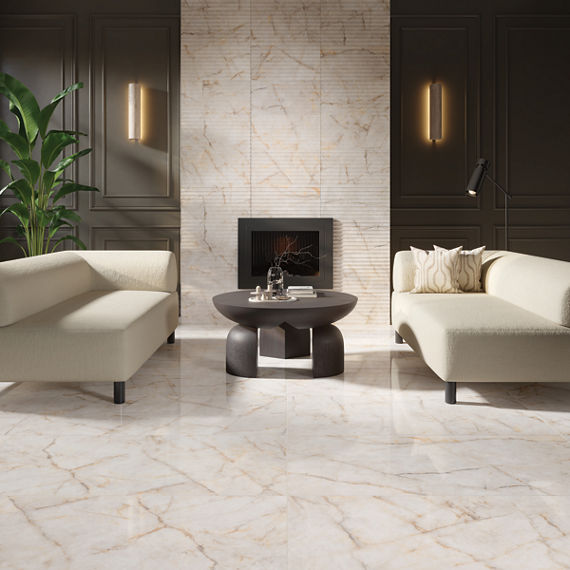 A contemporary living room features two cream-colored minimalist sofas facing a low round coffee table. The space is anchored by glossy marble-look flooring and a marble accent wall surrounding a sleek recessed fireplace. Dark paneled walls with vert