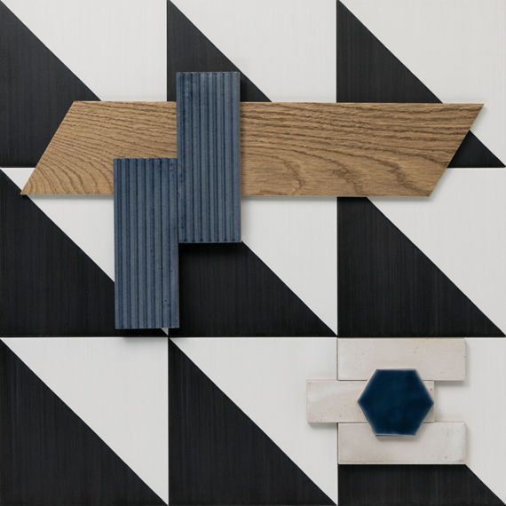 This flatlay contains encaustic tile accented by wood look chevron tile, raked tile, concrete accent tile, and a undulated glass look hexagon tile.