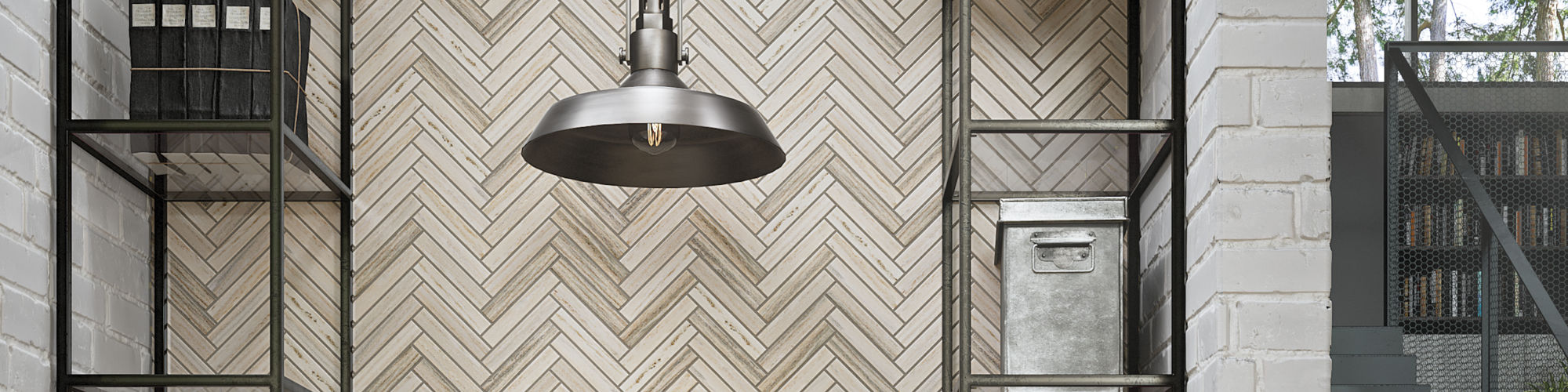 A contemporary kitchen nook features a striking herringbone tile backsplash in neutral tones. 