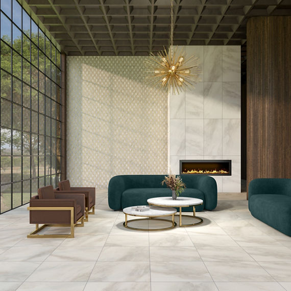 Sitting area with two green couches, two brown chairs, white marble look square floor tile, floor to ceiling windows, and a fireplace with white marble look rectangle tile surround on back wall. 
