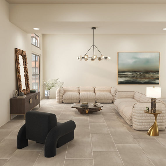 Living room with beige concrete look rectangle floor tile, two white couches, warm white walls, and gold accents.
