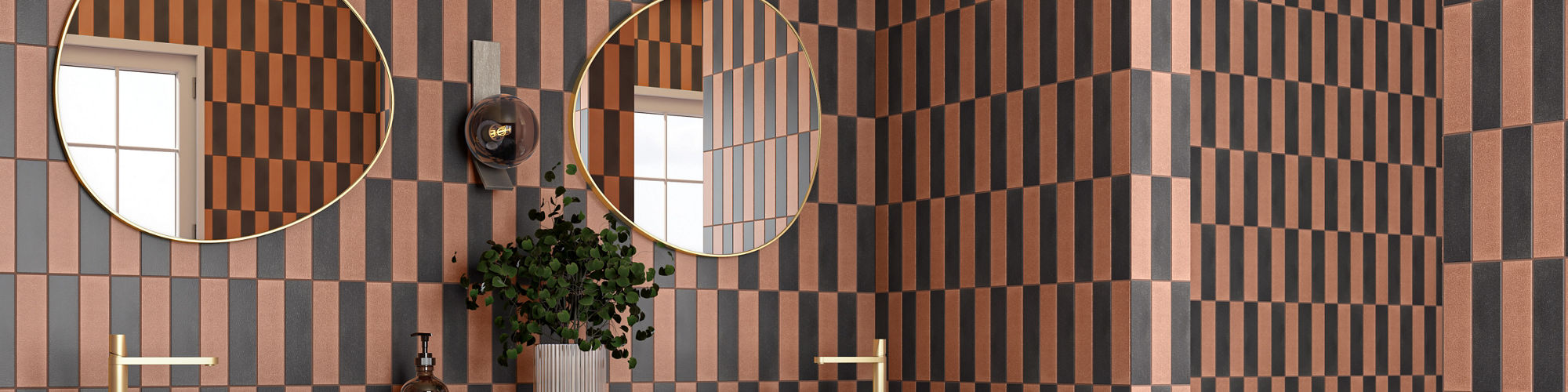 Bathroom with orange and black rectangle tile in vertical pattern on walls, black square tile on floor, and two white sinks on black marble look counter.