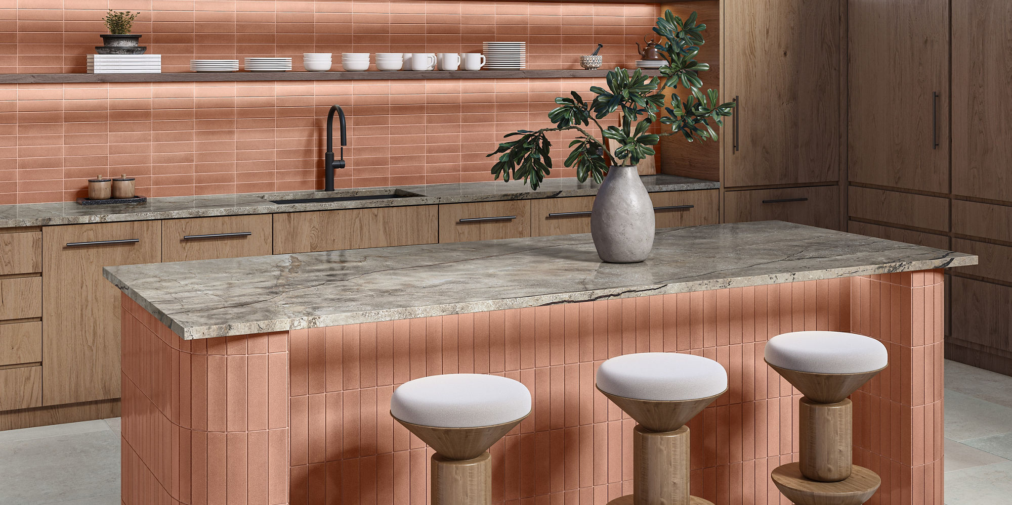 Kitchen with orange fabric look subway tile on backsplash and island counter, beige countertop, wooden cabinets, and white stone look rectangle floor tile.