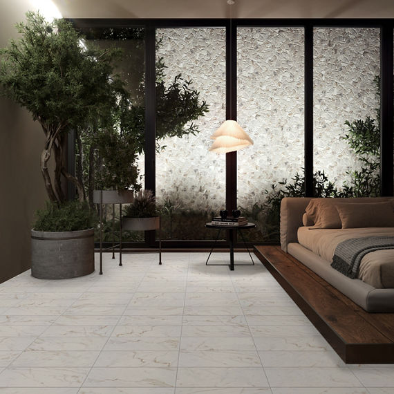 Bedroom with white rectangle marble look floor tile, white stone look mosaic on back wall, and tall tree on side.