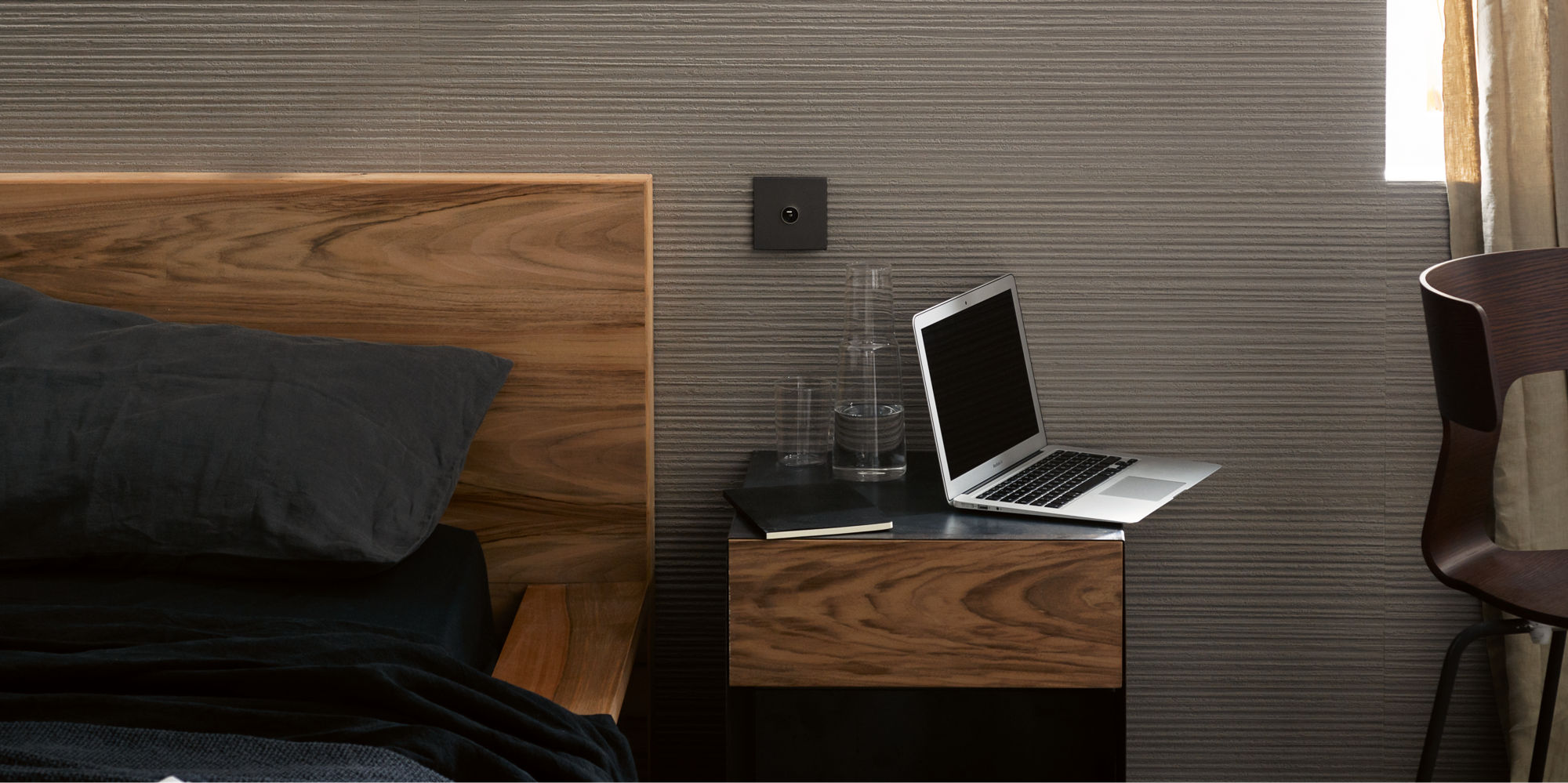 Bedroom with warm toned white fluted tile.