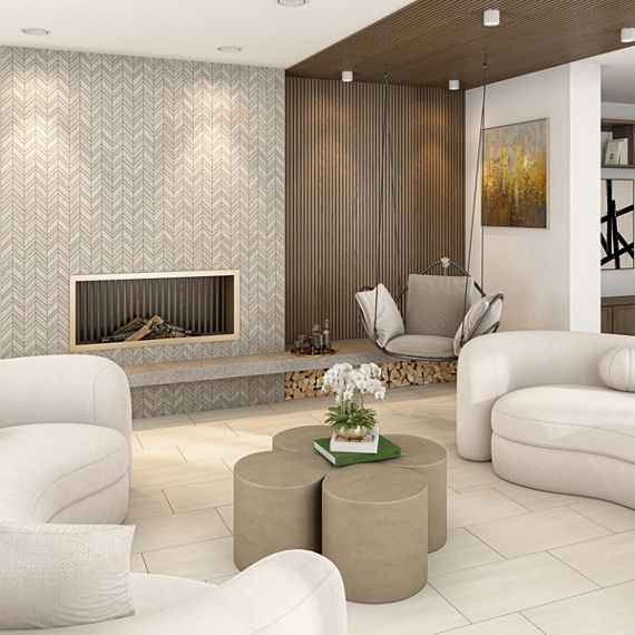 Living room with gray chevron mosaic tile on fireplace, beige stone look rectangle tile on floor, two white couches, and golden clover shaped table.