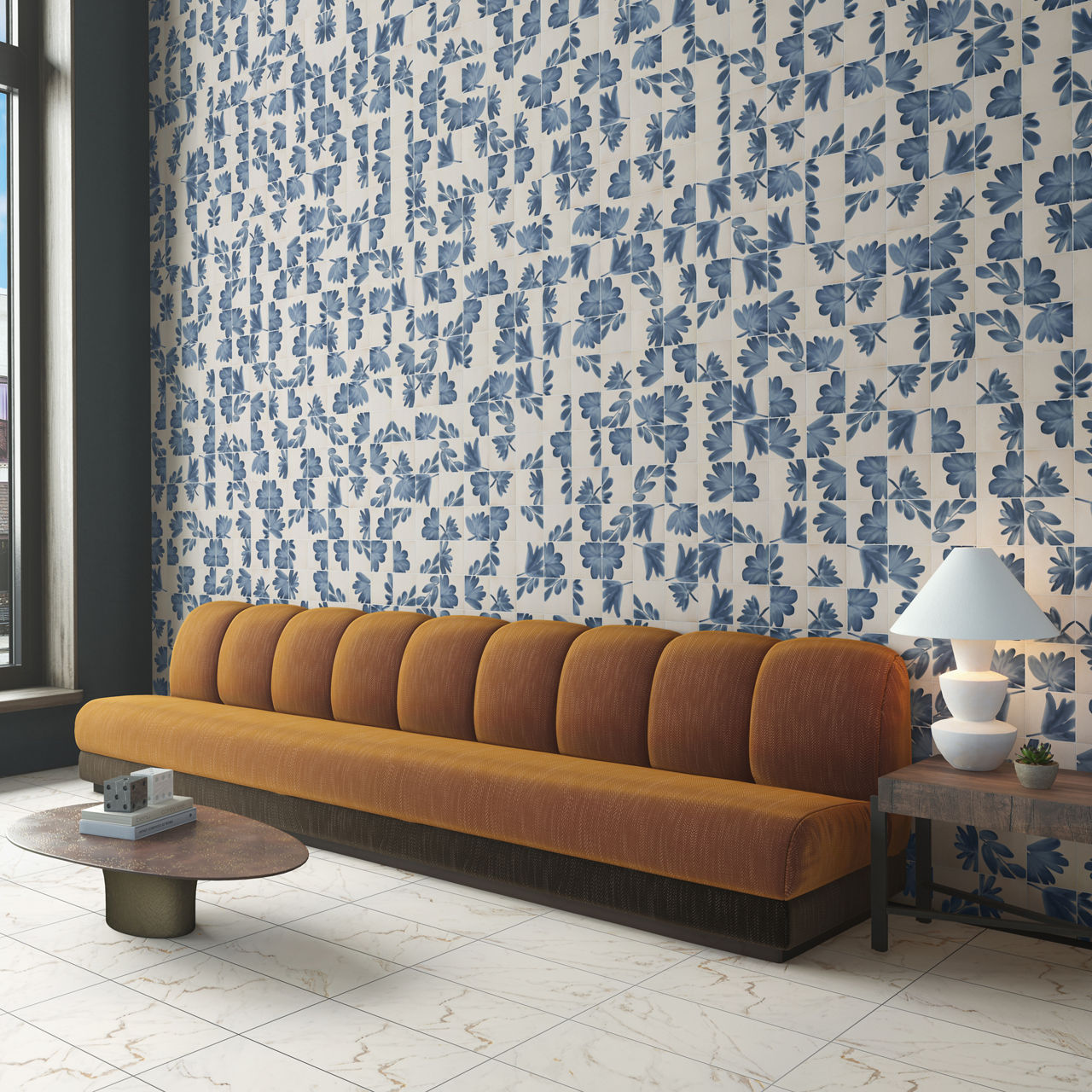 Yellow couch with white encaustic concrete look tile on back wall, white marble look rectangle floor tile, and wood accents.