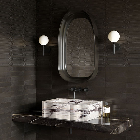Bathroom with white marble sink, gray marble countertop, silver fixtures, and black rectangle subway tile on background.