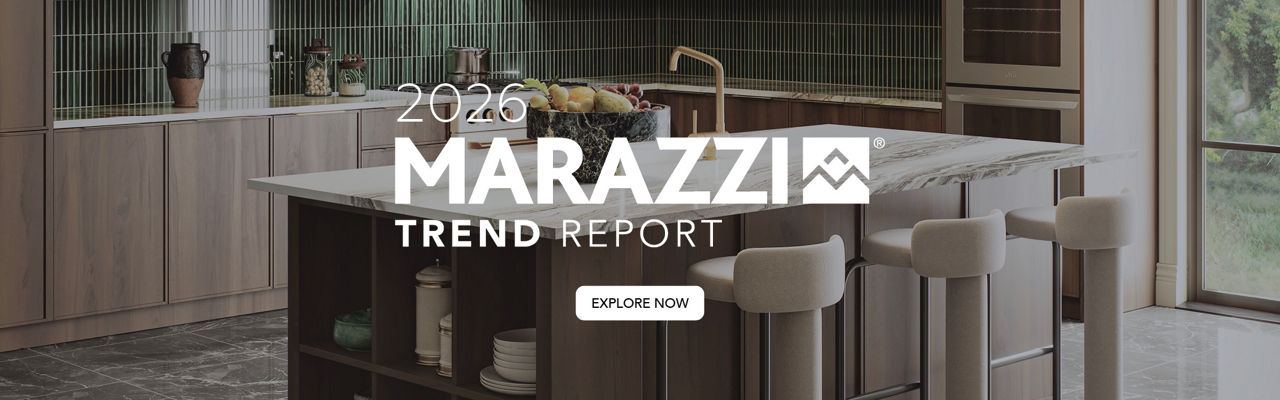 A contemporary kitchen featuring sleek cabinetry, a marble island, and green tiled backsplash. 