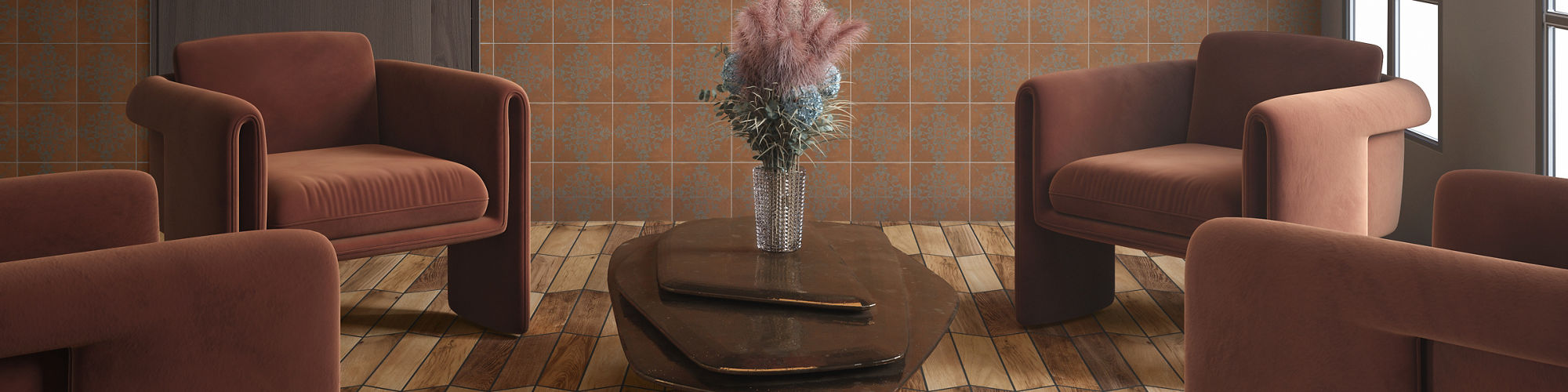 Living area with 4 brown chairs, wood look chevron floor tile, and orange encaustic tile on back wall.