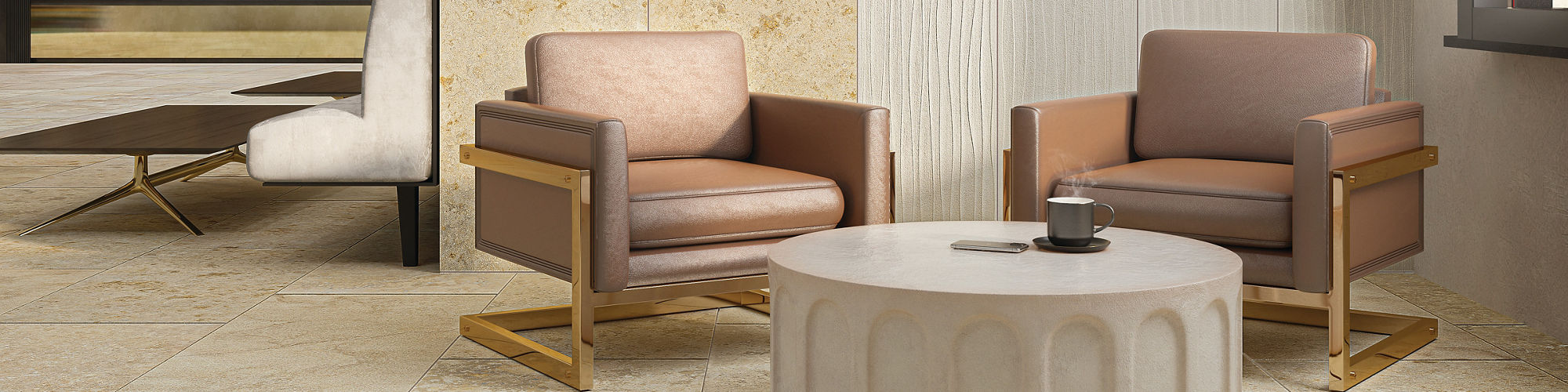 Lobby sitting area with two pink chairs, beige stone look rectangle tile on floors and wall, and white rectangle tile on other half of wall with wave pattern. 