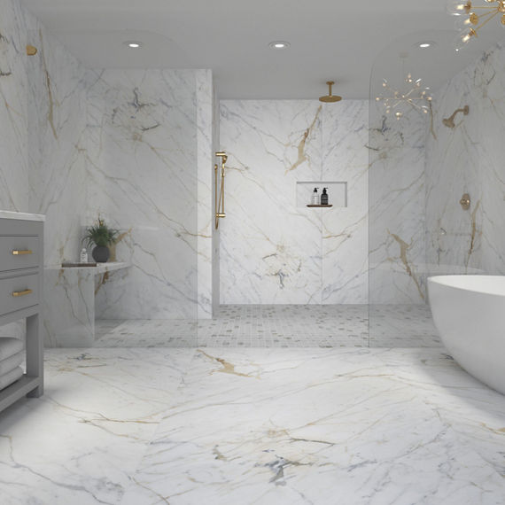 Shower with white marble on the walls and floor, and white mosaic on the shower floor.