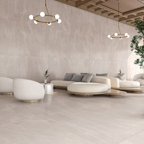 High end lounge area with white couches and chairs, wood ceiling, and beige marble look porcelain slab on walls and floor.