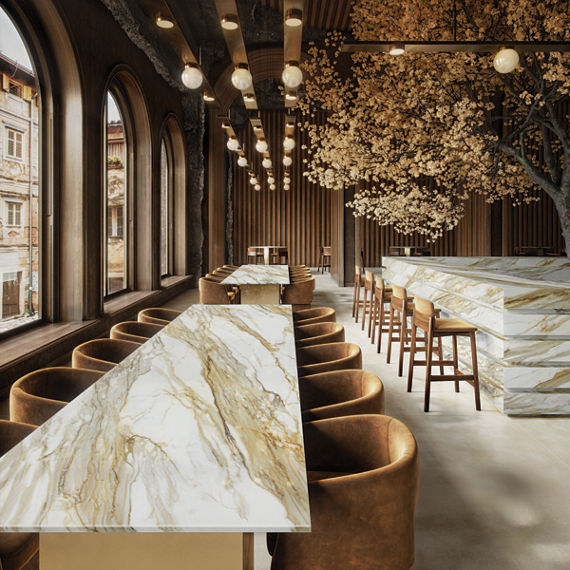 Restaurant with white marble look porcelain slab on tables and bar, brown leather chairs at tables, and tree in the center of the bar.