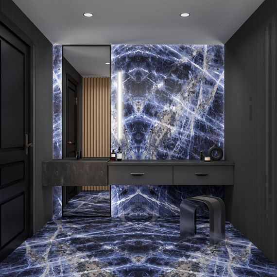 Bathroom featuring wall and flooring of large formal porcelain slab with dark blue and white veining that looks like marble, floor to ceiling mirror, and dark grey floating vanity.