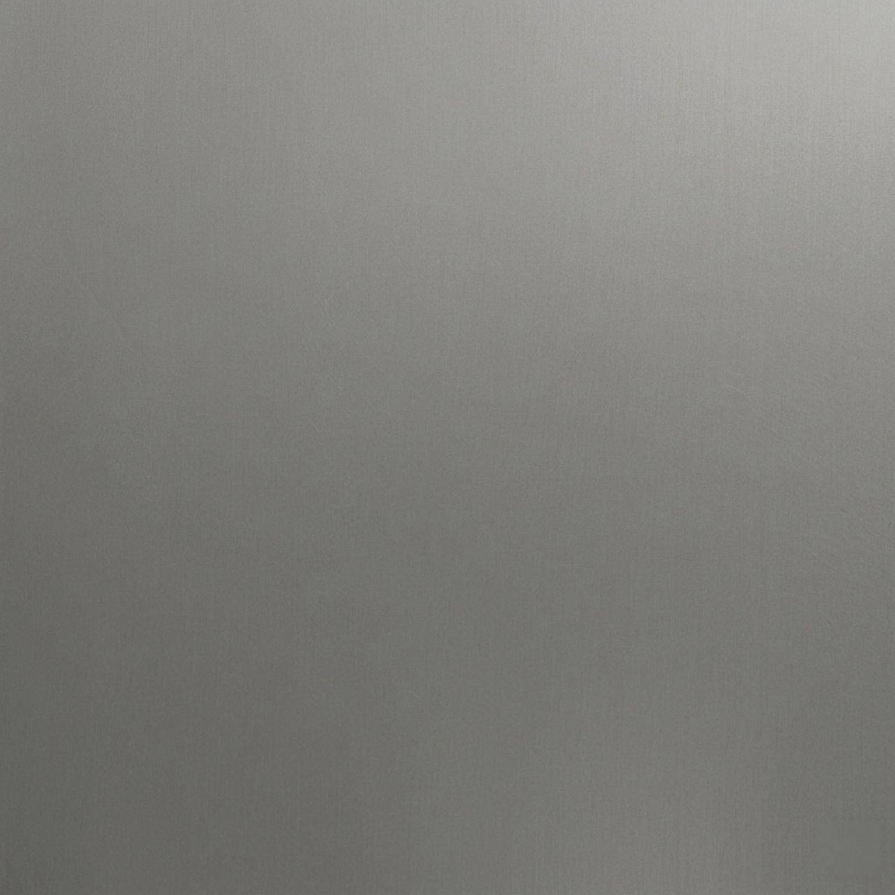 Abstract close-up of a brushed metallic silver surface. The image shows a smooth, slightly reflective texture with subtle vertical grain. Soft gradients of light and shadow create a minimal, modern appearance. The neutral tone makes it suitable as a 