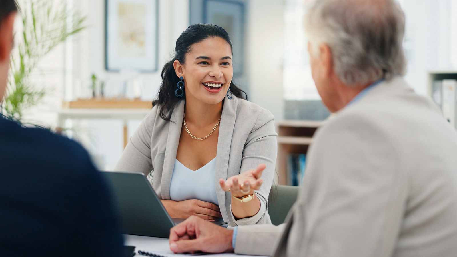 Smile, meeting and planning with business people in office for account manager, teamwork or discussion. Investment portfolio, client research and talking with group of employees in agency for review.