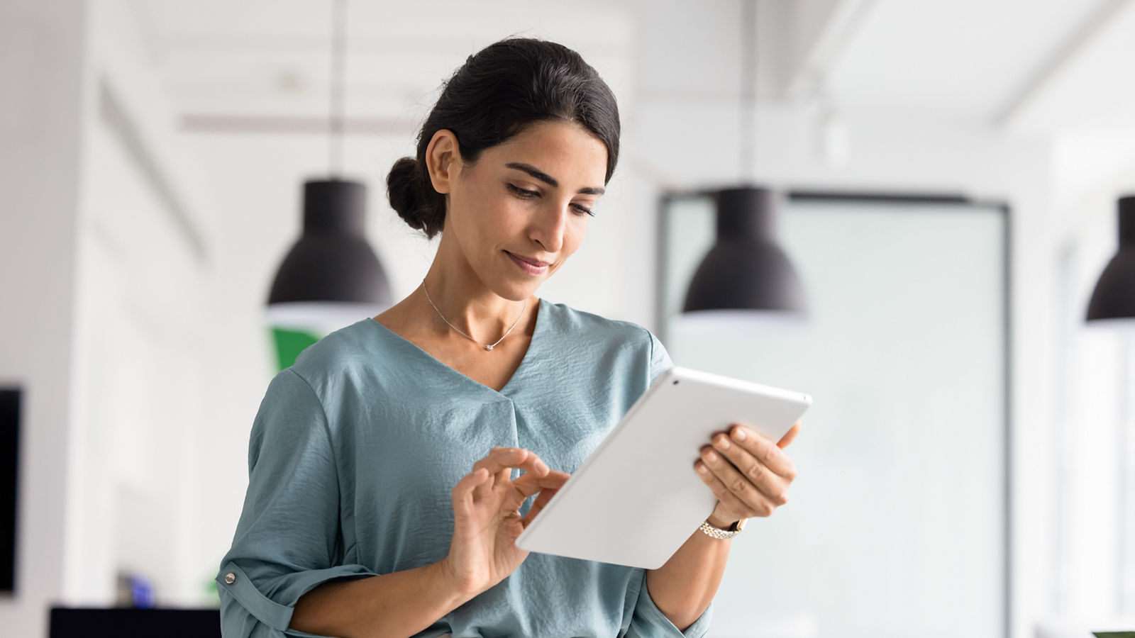 Woman using tablet in a modern office