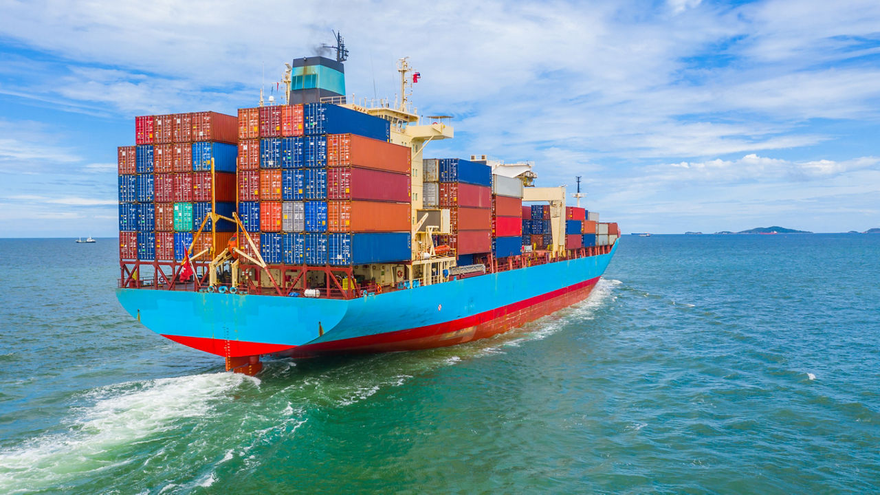 Container ship leaving the industrial port, Import and export business logistic and transportation of international by container ship in the open sea.