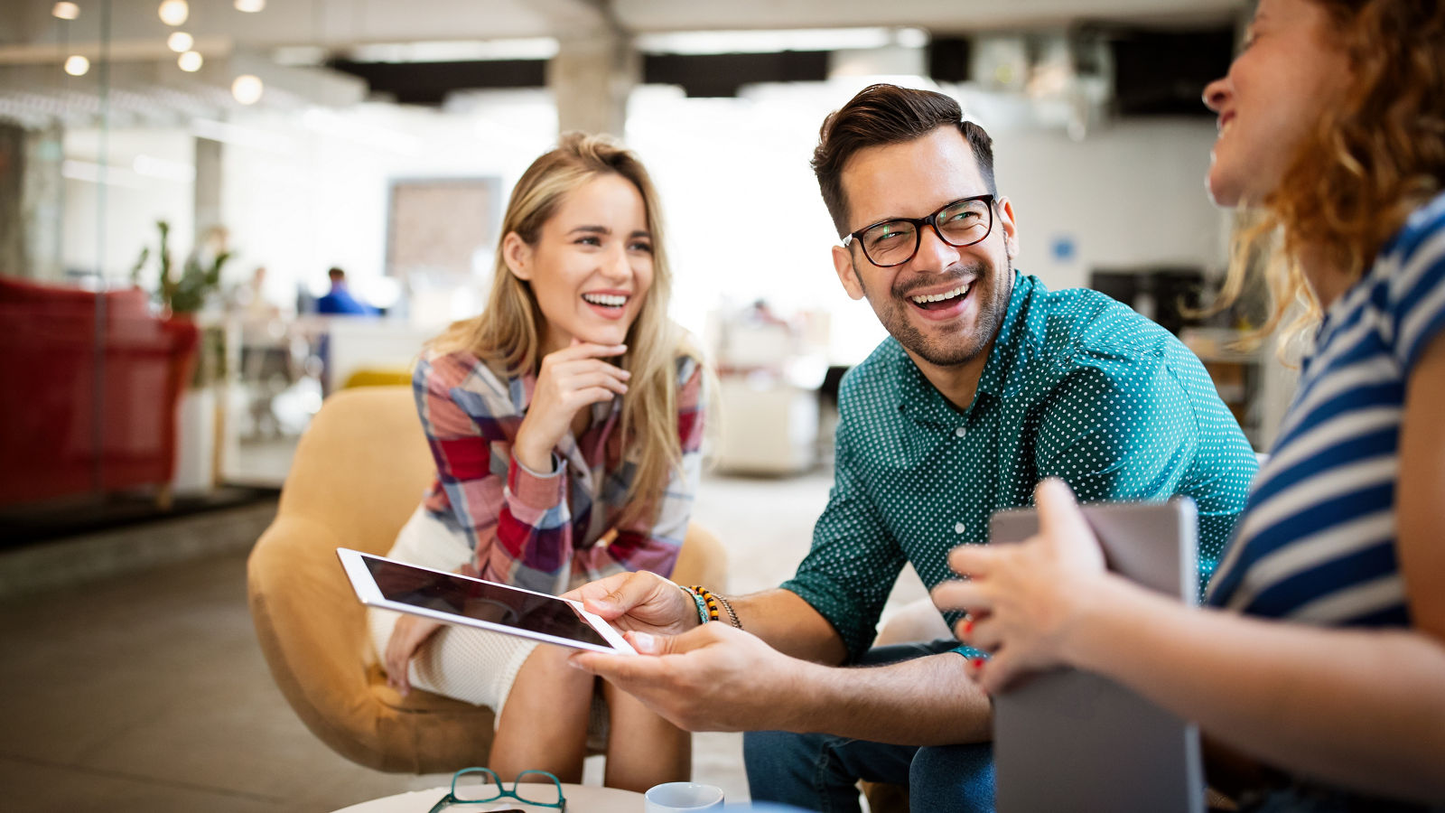 Business people, designers having fun and chatting at workplace office