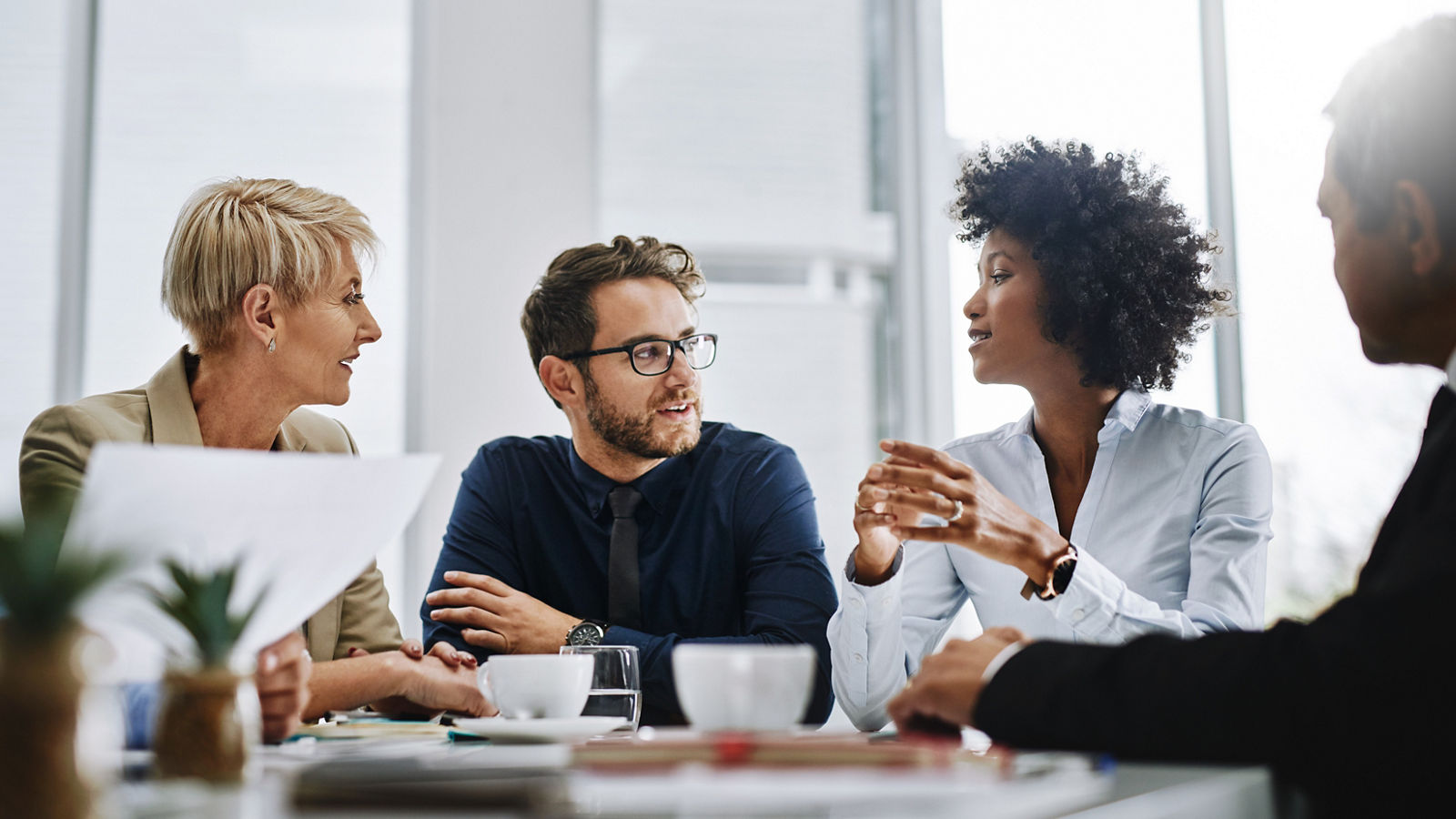 Shot of a group of businesspeople sitting together in a meeting