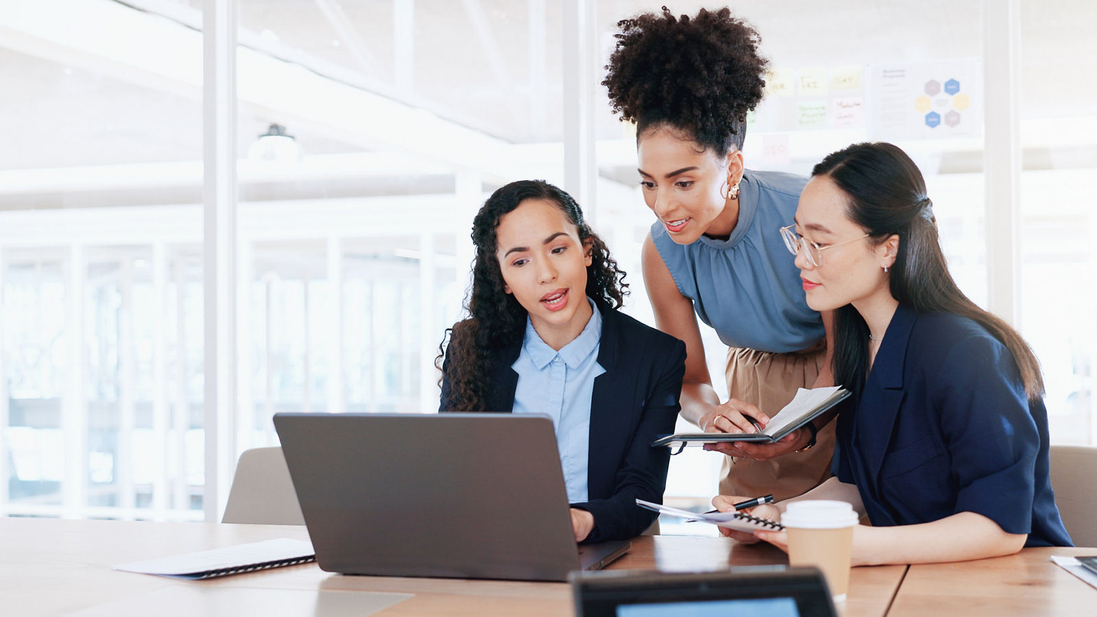 Business women, laptop and collaboration in office 